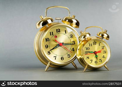 Time concept - alarm clock against colorful background