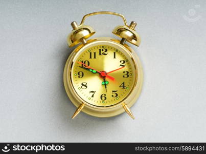 Time concept - alarm clock against the background