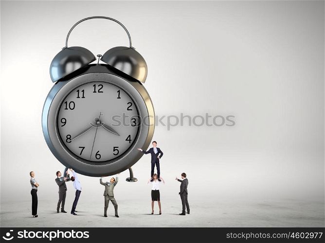 Time concept. Big old-style clock and many businesspeople around