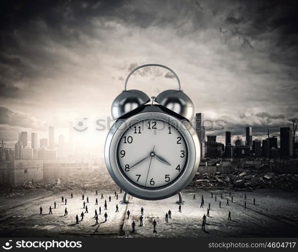 Time concept. Big old-style clock and many businesspeople around