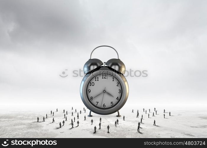 Time concept. Big old-style clock and many businesspeople around