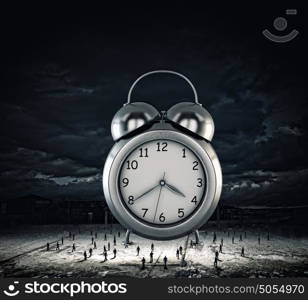 Time concept. Big old-style clock and many businesspeople around