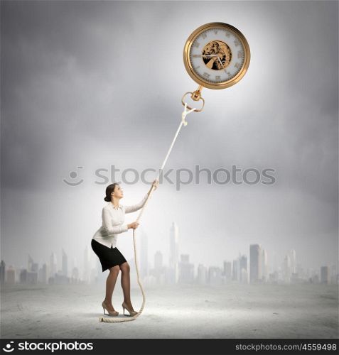 Time concept. Image of attractive businesswoman and pocket watch. Time for business
