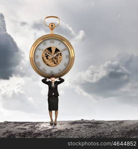 Time concept. Image of attractive businesswoman and pocket watch. Time for business