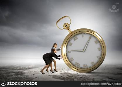 Time concept. Image of attractive businesswoman and pocket watch. Time for business