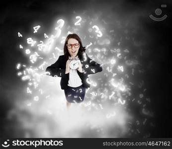 Time concept. Top view of businesswoman holding alarm clock