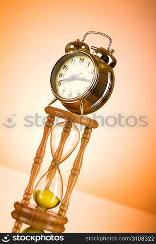 Time concept with clock and hour glass