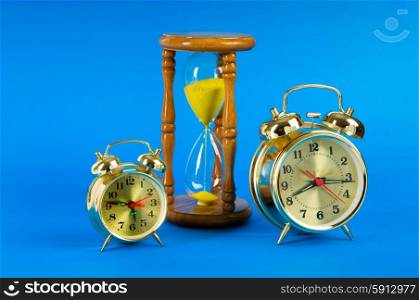 Time concept with clock and hour glass