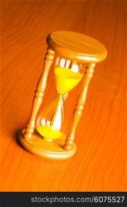 Time concept with hourglass against background
