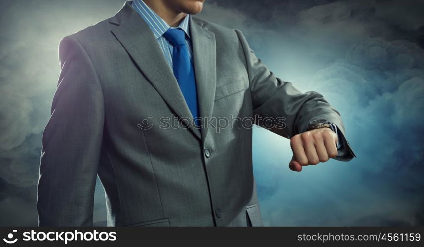 Time for business. Close up of businessman looking at watch