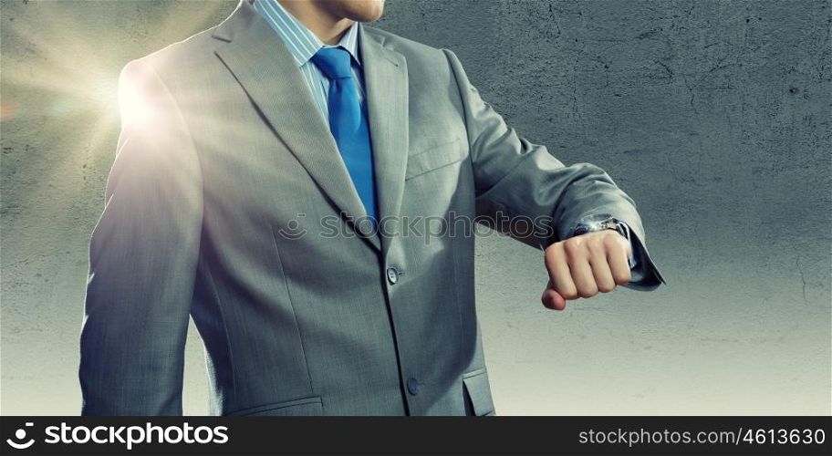Time for business. Close up of businessman looking at watch