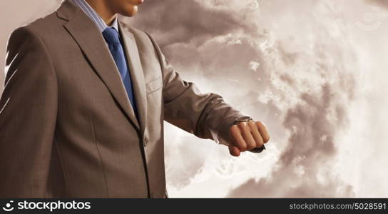 Time for business. Close up of businessman looking at watch