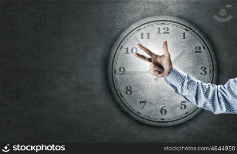 Time for business. Hand of businessman showing finger gesture and time concept