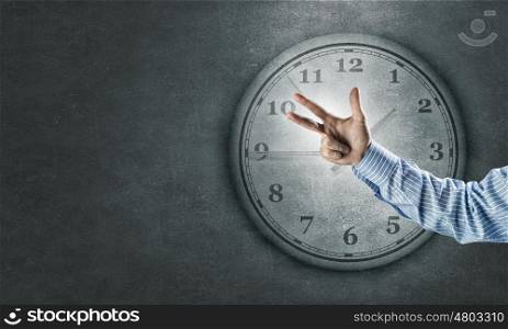 Time for business. Hand of businessman showing finger gesture and time concept