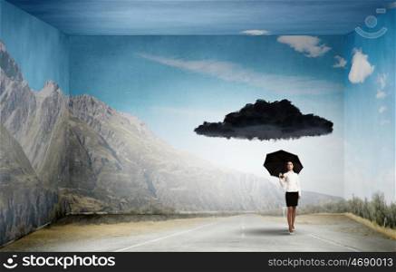 Time for challenge. Bad luck and crisis concept with young businesswoman with black umbrella