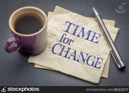 time for change - handwriting on a napkin with cup of coffee against gray slate stone background