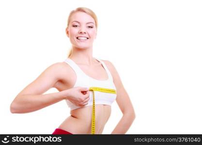 Time for diet slimming weight loss. Health care and healthy nutrition. Young fitness woman fit girl with measure tape measuring her bust size chest isolated on white