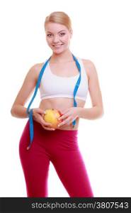 Time for diet slimming weight loss. Health care and healthy nutrition. Young fitness woman fit girl with measure tape and fruit apple isolated on white