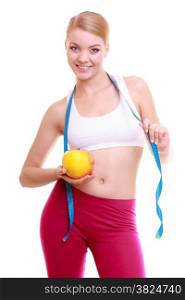 Time for diet slimming weight loss. Health care and healthy nutrition. Young fitness woman fit girl with measure tape and fruit apple isolated on white