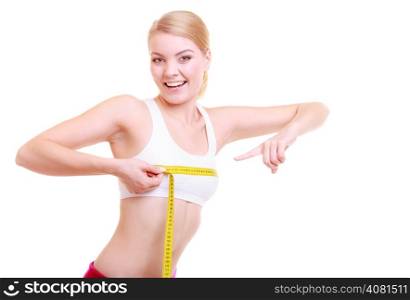 Time for diet slimming weight loss. Health care and healthy nutrition. Young fitness woman fit girl with measure tape measuring her bust size chest isolated on white