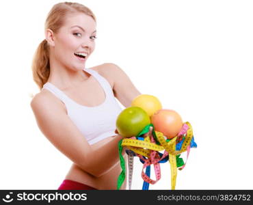 Time for diet slimming weight loss. Health care healthy lifestyle. Happy sport fit fitness woman blonde girl with a lot of colorful measure tapes and fruits isolated on white background