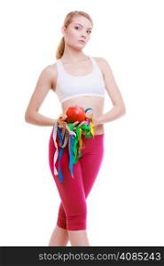 Time for diet slimming weight loss. Health care healthy lifestyle. Young sport fit fitness woman blonde girl with a lot of colorful measure tapes and fruit isolated on white background
