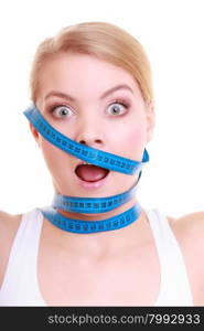 Time for diet slimming weight loss. Health care healthy lifestyle. Fit fitness woman with violet measure tapes around her head. Obsessed girl by body isolated