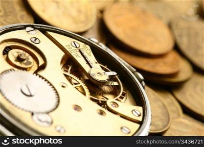 time is money coins and clock macro concet