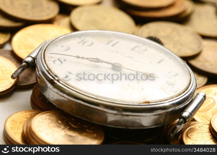 time is money coins and clock macro concet