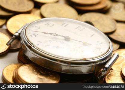 time is money coins and clock macro concet