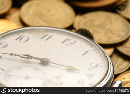 time is money coins and clock macro concet