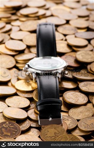 Time is money concept with watch and coins&#x9;