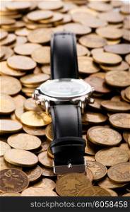 Time is money concept with watch and coins&#x9;