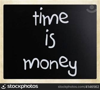 ""Time is money" handwritten with white chalk on a blackboard"