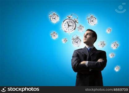 Time is money. Image of young businessman and pocket watch. Time concept