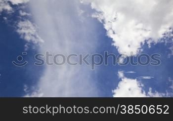 Time lapse clouds and water drops on reflective surface, vertical sky