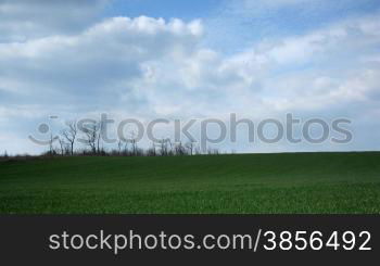 time lapse, green grass and white clouds