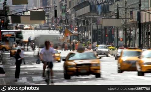 Time lapse of busy city traffic and pedestrians on a street in New York