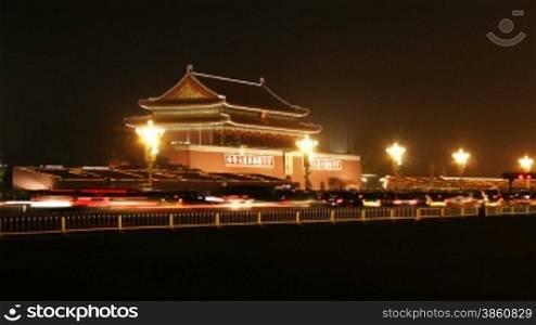 time lapse of city traffic at night, Tiananmen, Beijing, China.