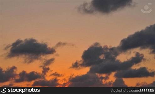 Time lapse of clouds passing by during sunset - Wolken im Zeitraffer waehrend eines Sonnenuntergangs
