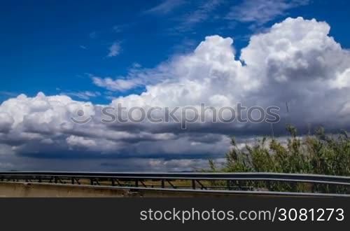 Time-lapse of cloudy sky next the highway in Italy, Tuscany