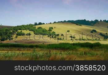 Time lapse of hilly landscape in summer