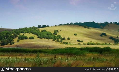 Time lapse of hilly landscape in summer