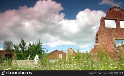 time lapse ruins of old factory with running clouds.