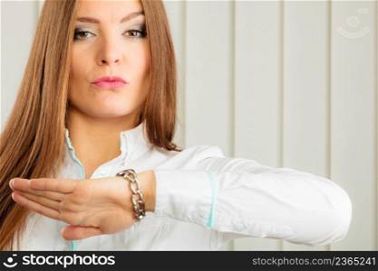 Time management in work office pressure and supervision. Young female dissatisfied worker boss check time on watch.. Woman in formal wear check time on watch.