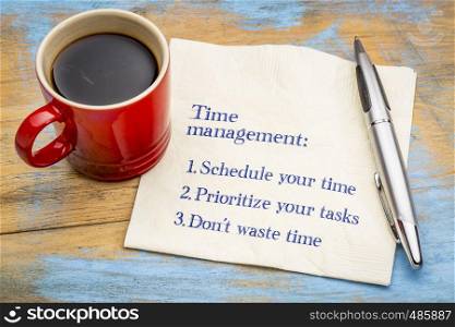 Time management tips - handwriting on a napkin with a cup of coffee