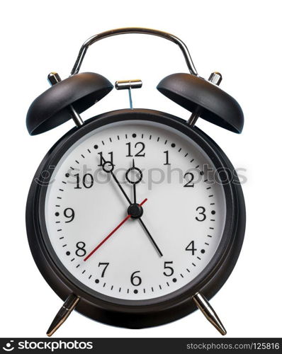 Time running out concept with alarm clock approaching midnight and isolated against white background. Alarm clock approaching midnight and isolated against white