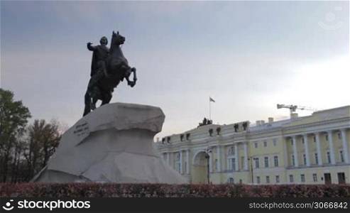 Timelapse. A monument to Peter the great - the bronze horseman and passing airplane.
