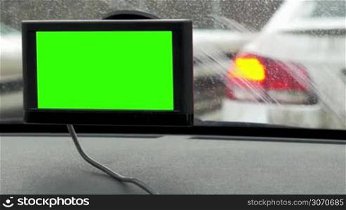 Timelapse and close-up shot of GPS device with chroma key inside the car standing in traffic jam
