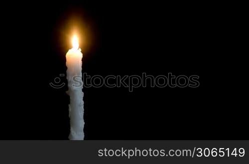 Timelapse burning white candle